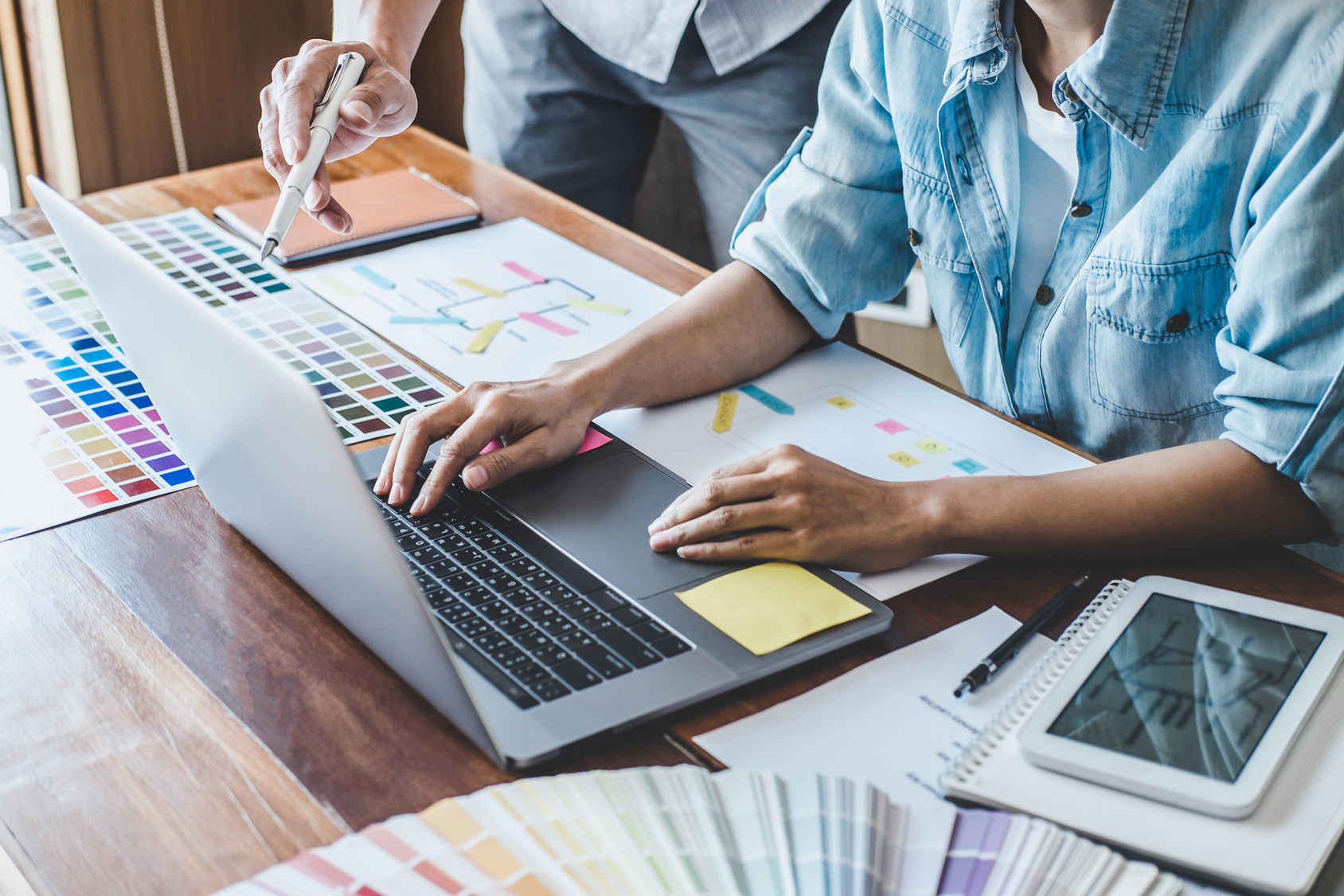 Working documents and laptop used to plan practical business activities